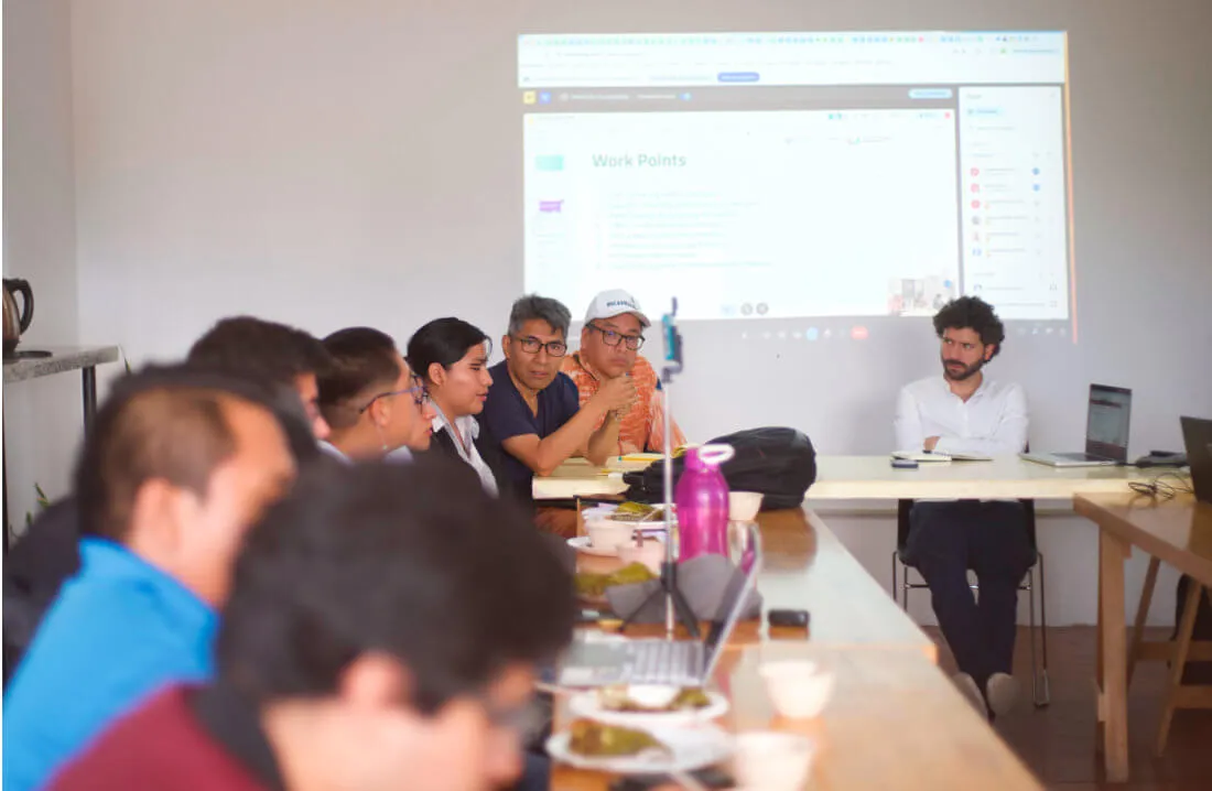 The group in the co-working space, in the midst of discussion