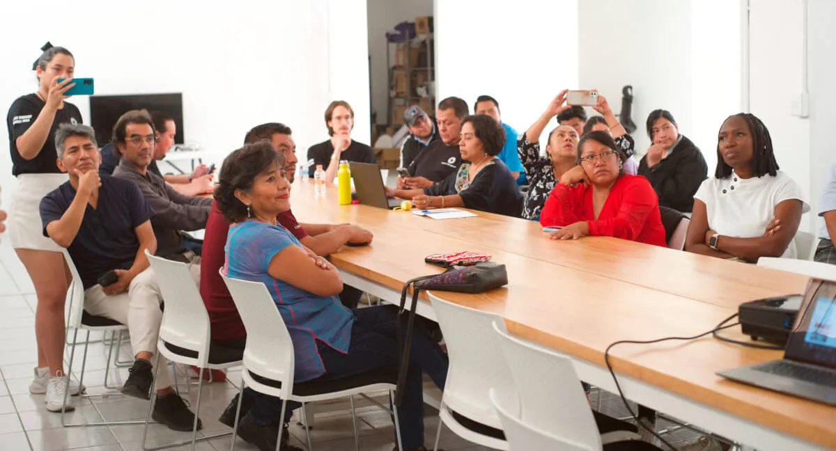 Group in the Red Oaxaca offices listening to a presentation