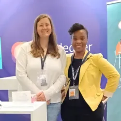 Interledger team members standing at their booth at the AfriLabs gathering