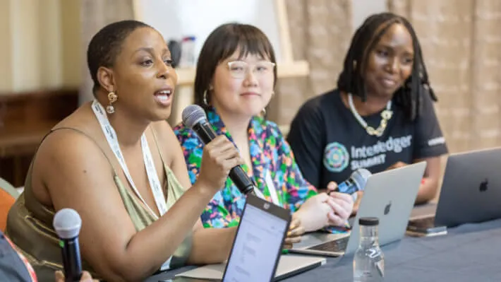 Women participating in a panel discussion